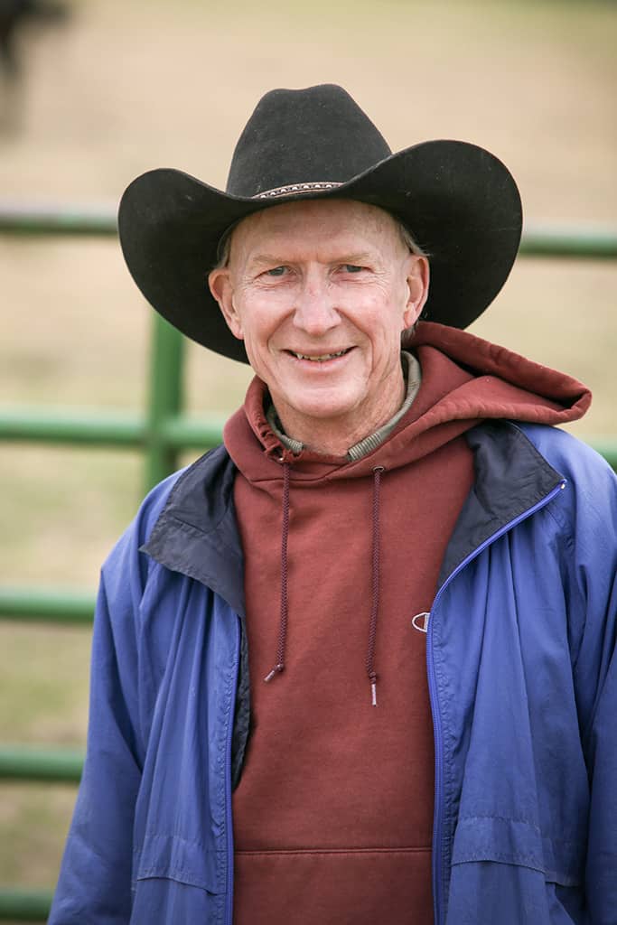 happy-mature-man-cowboy-relaxed-pasture